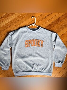 Spooky Grey Crewneck Sweatshirt with Orange Lettering